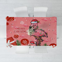 Pink flamingo Christmas tablecloth with “Merry Christmas” and snowflake decorations
