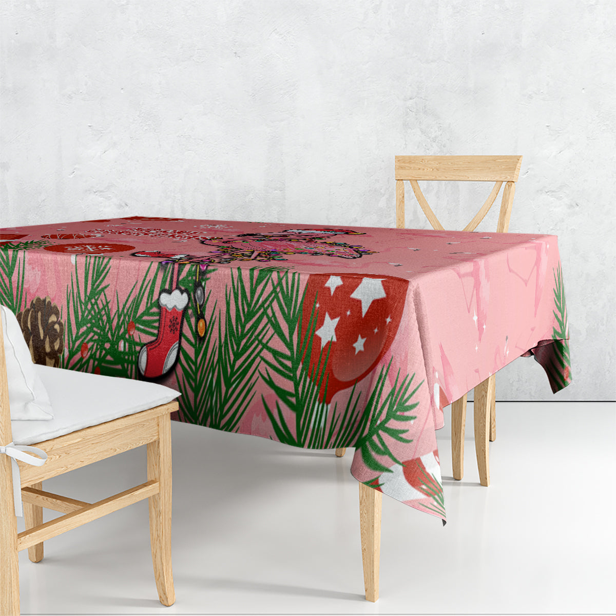 Pink flamingo Christmas tablecloth with pine leaves, stockings, and star accents