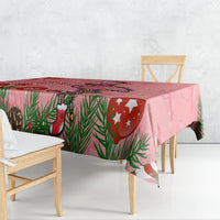 Pink flamingo Christmas tablecloth with pine leaves, stockings, and star accents