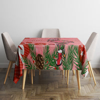 Pink flamingo Christmas tablecloth with pine leaves, a flamingo, and hanging sock