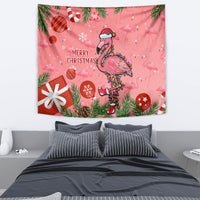 Pink flamingo Christmas tapestry with 'Merry Christmas' lettering and pine leaves