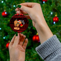Round ceramic Christmas ornament with capybara Santa holding watermelon, red holiday design