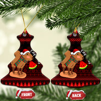 Bell-shaped ceramic Christmas ornaments featuring capybara Santa holding watermelon slice