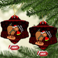Snowflake-shaped ceramic Christmas ornament with capybara Santa holding watermelon, red pattern