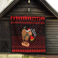 Red and black Christmas capybara quilt hanging on a wall, showing Santa-hat capybara