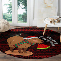 Red round Christmas rug featuring capybara with Merry Christmas lettering