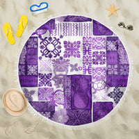 Round purple patchwork beach blanket with tiki center medallion and white fringe trim