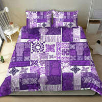 Purple patchwork quilt bedding set with white patterned blocks and two matching pillowcases