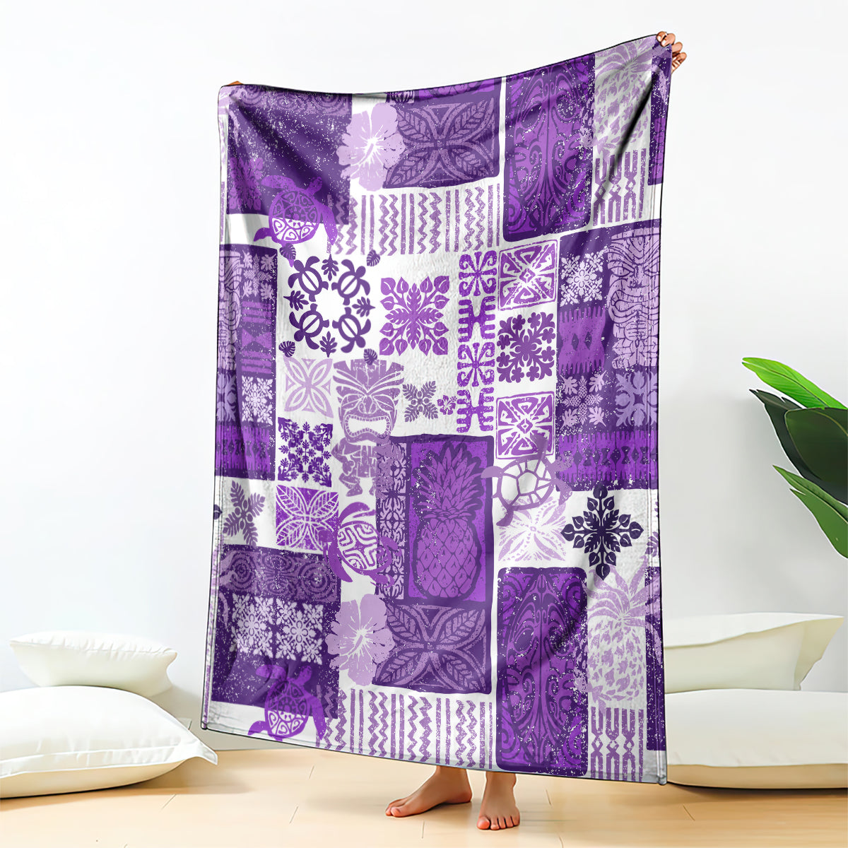 Purple tiki patchwork quilt blanket, draped over chair back with patchwork design