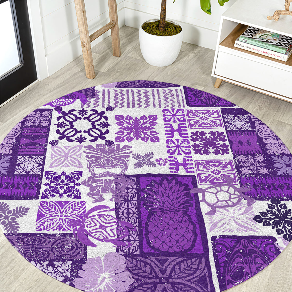 Round purple patchwork quilt-style carpet with white tiki motifs in decorative blocks