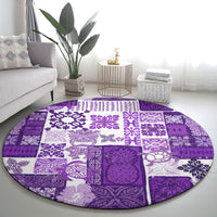 Round purple patchwork quilt-style carpet with white floral and tiki-inspired motif panels