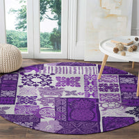Round purple quilt-style carpet with white tiki icons and patchwork square panels
