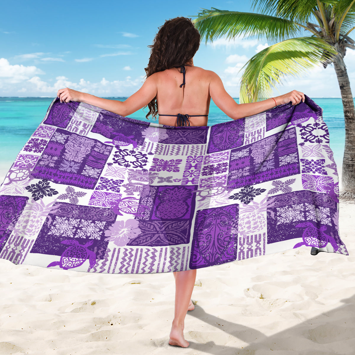 Purple quilt sarong with white patterned motifs, draped open across front and back.