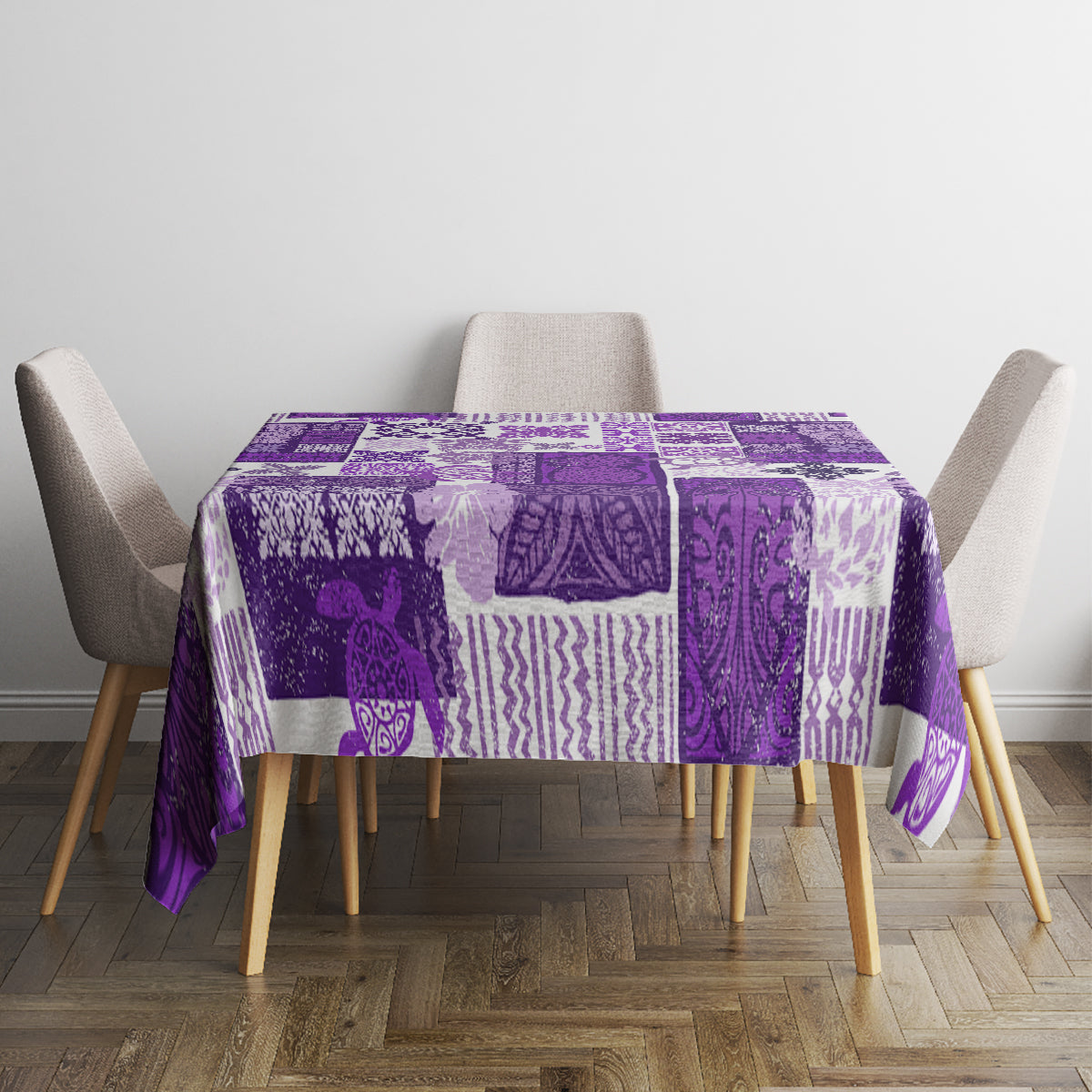 Purple patchwork tablecloth on square table with tiki-inspired geometric designs.