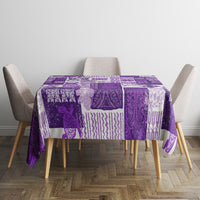 Purple patchwork tablecloth on square table with tiki-inspired geometric designs.