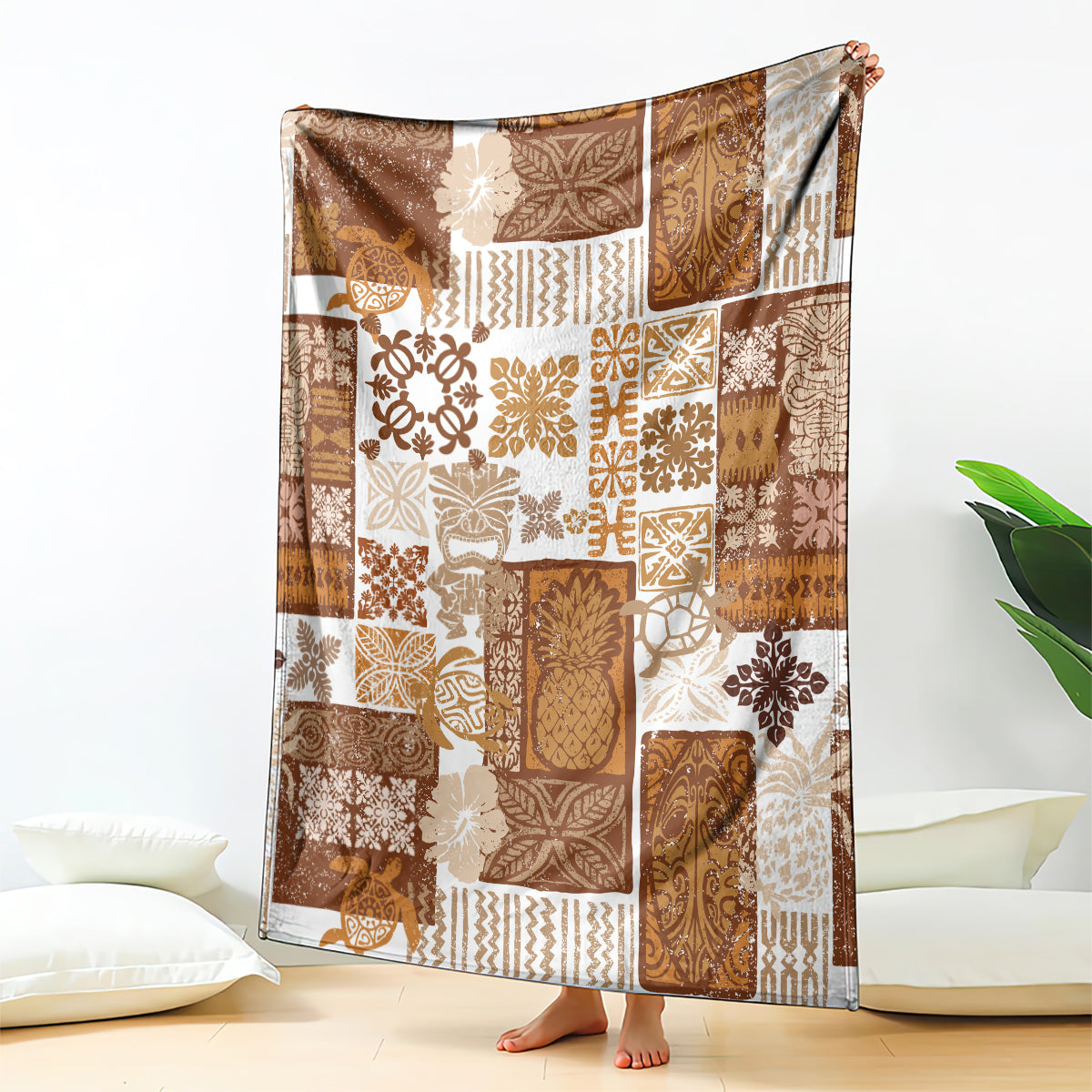 Brown patchwork quilt blanket with tropical tiki motifs and geometric pattern blocks
