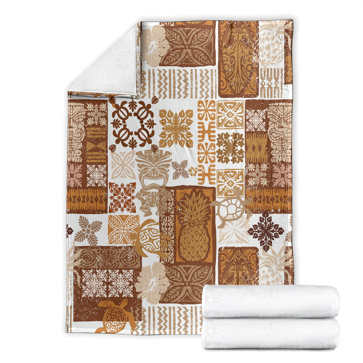 Brown and cream patchwork quilt blanket with tropical tiki motifs and stitched borders