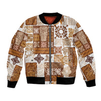 Unisex bomber jacket with brown tiki patchwork quilt print, full-zip front, ribbed cuffs