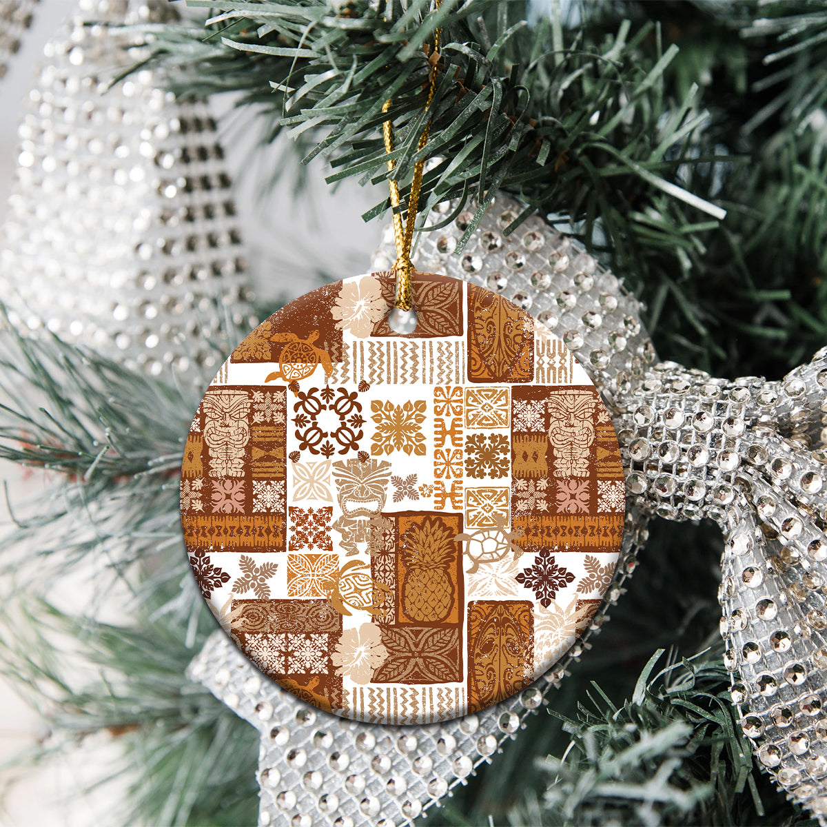 Brown quilt-style ceramic circle ornament hanging on Christmas tree