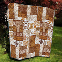 Brown patchwork quilt with white lattice and floral/tiki print blocks