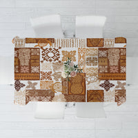 Brown quilt-style tablecloth with patchwork tiki motifs and geometric patterns