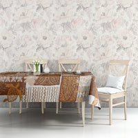Brown quilt-style tablecloth with patchwork tiki and geometric motifs on dining table