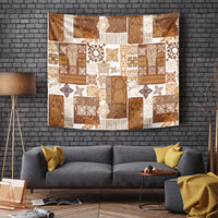 Brown tropical patchwork quilt tapestry with tiki icons and floral patterns; rectangular wall hanging