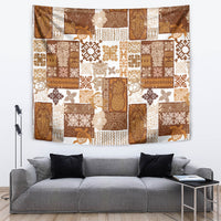 Brown tropical patchwork quilt tapestry showing tiki motifs, florals, and patterned panels; hanging