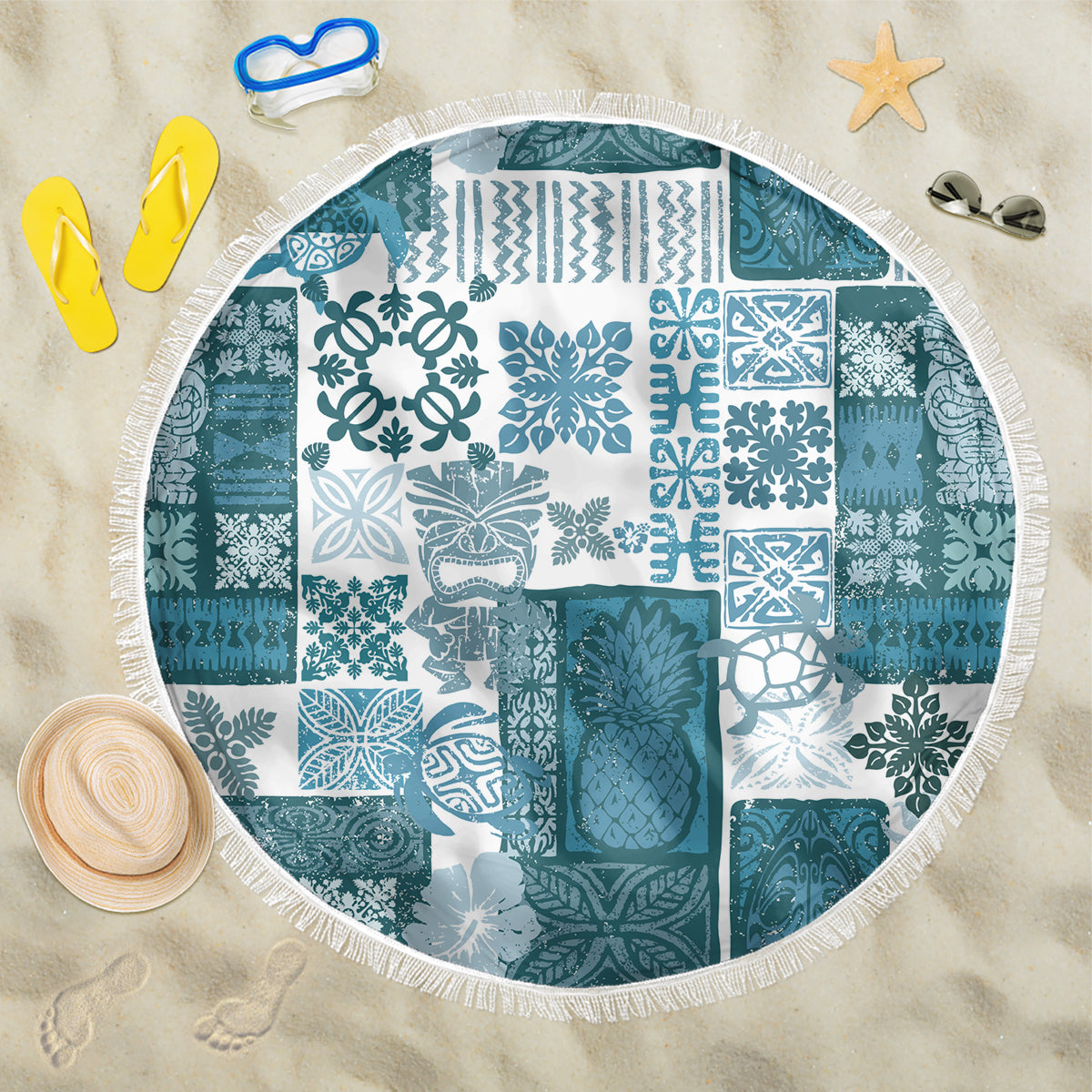 Round beach blanket with dark cyan and white tiki patchwork medallion print, fringed rim