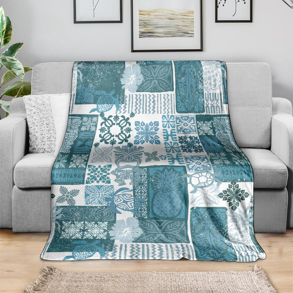 Dark cyan patchwork quilt blanket with white tropical motifs and geometric tile patterns