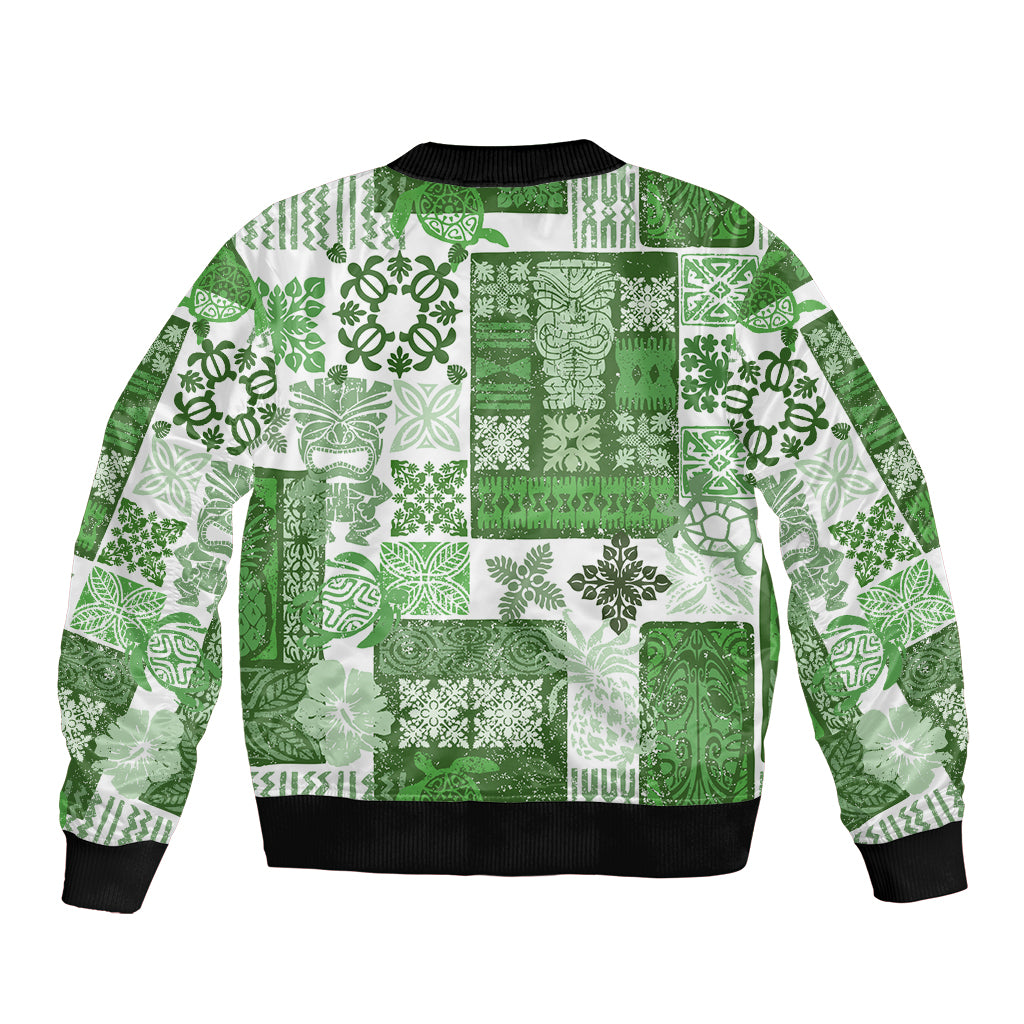 Green patchwork bomber jacket with tiki tropical print, ribbed hem and cuffs