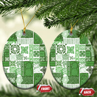 Green patchwork ceramic oval ornament with gold hanging loop; front and back shown