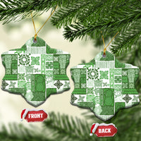 Green patchwork ceramic snowflake ornament with gold hanging loop; front and back shown