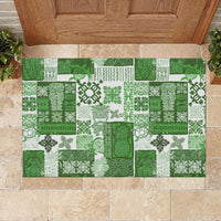 Green and white patchwork tiki quilt doormat with dense clover and leaf pattern