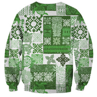 Unisex green quilt-style sweatshirt back with tiki and floral patchwork print, crew neck