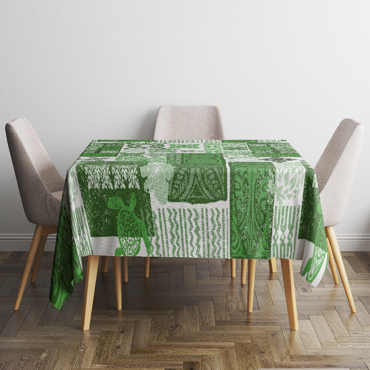 Green tiki patchwork tablecloth with repeating patterns on a dining table with chairs