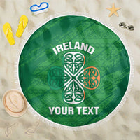Green round beach blanket with white fringe, Ireland text and Celtic knot design