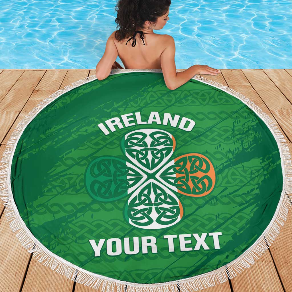 Green round beach blanket with white fringe, Ireland text and Celtic trinity knot