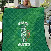 Green Ireland quilt blanket with white Celtic knot and “YOUR TEXT” print, quilted texture
