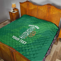 Green Ireland quilt blanket on a bed with Celtic knot graphic and “YOUR TEXT”
