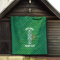 Green Ireland quilt blanket with Celtic knot emblem and “YOUR TEXT” on porch