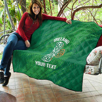 Green Ireland quilt blanket with Celtic knot and “YOUR TEXT” held outdoors