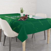 Green tablecloth with Celtic knot emblem and custom text, draped over table