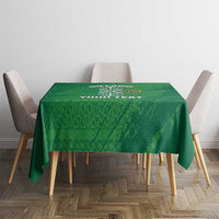 Green tablecloth with Celtic knot and custom text on dining table