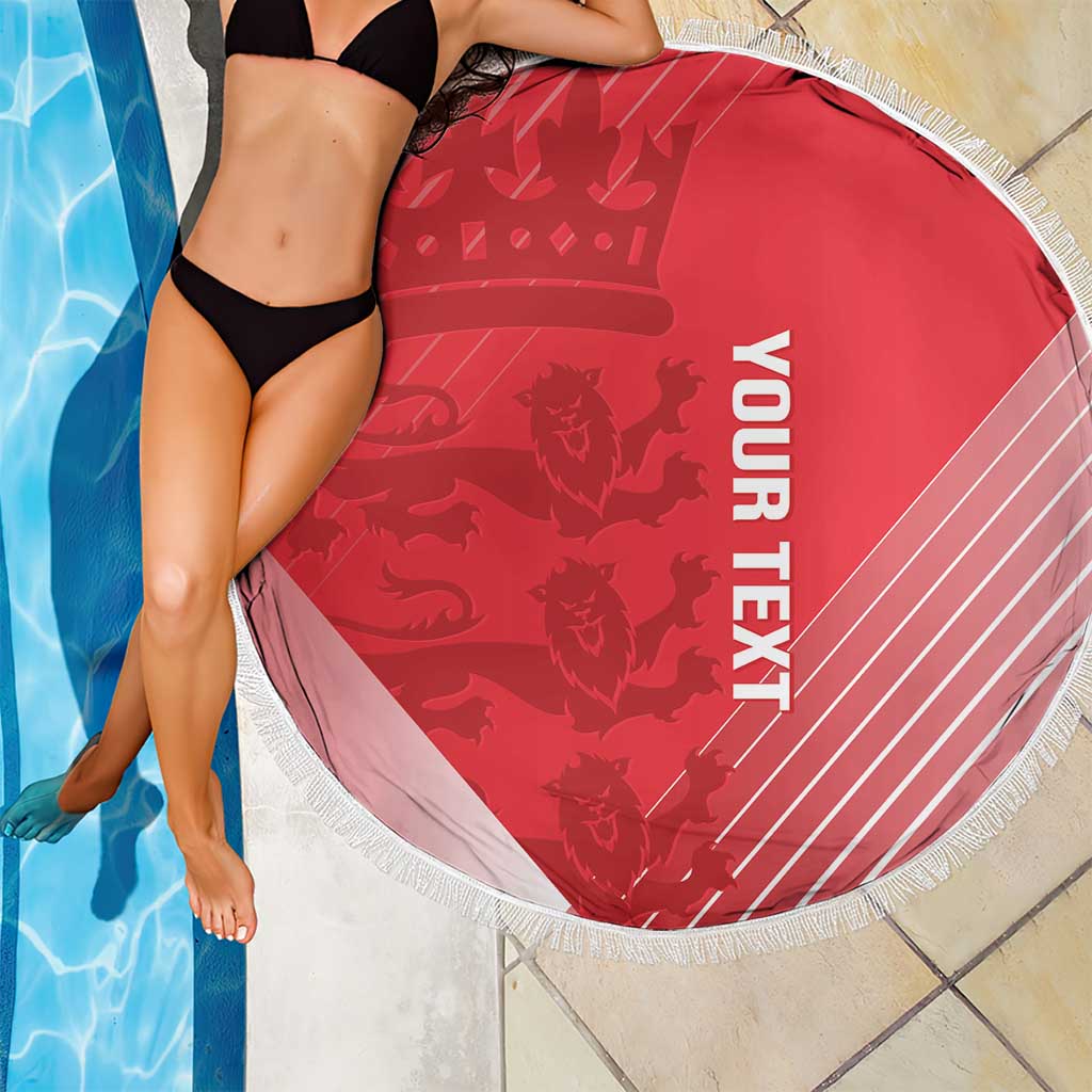 Red round beach blanket with fringed edge and white “YOUR TEXT” text beside pool.