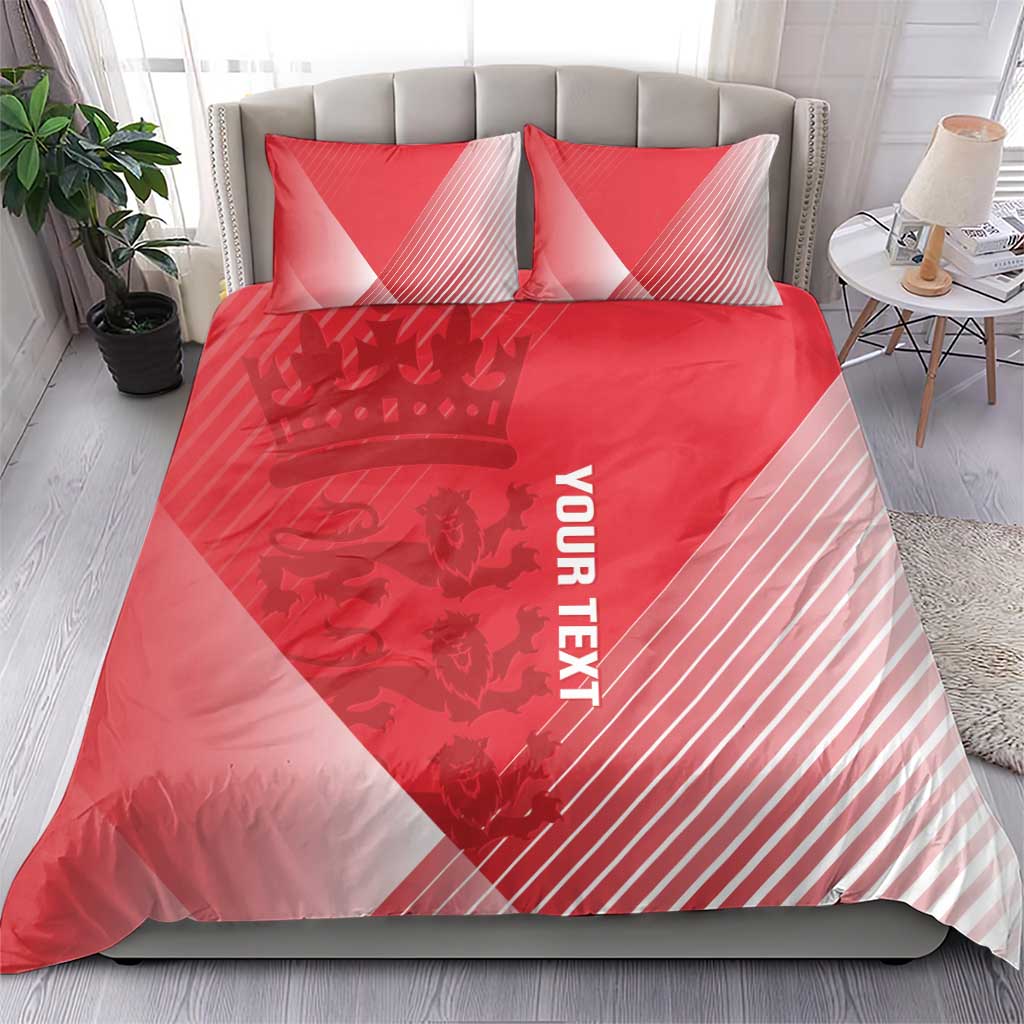 Red duvet cover and two pillowcases with crown graphics, diagonal stripes, and 'YOUR TEXT'