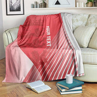 Red cricket-themed blanket with crown graphic, diagonal panels, and vertical 'YOUR TEXT' print