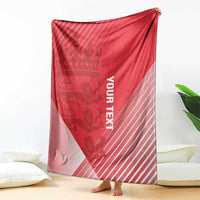 Red cricket blanket draped upright with crown design, diagonal stripes, and vertical 'YOUR TEXT'
