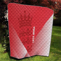 Red and white diagonal quilt blanket with diamond quilting and black edge trim