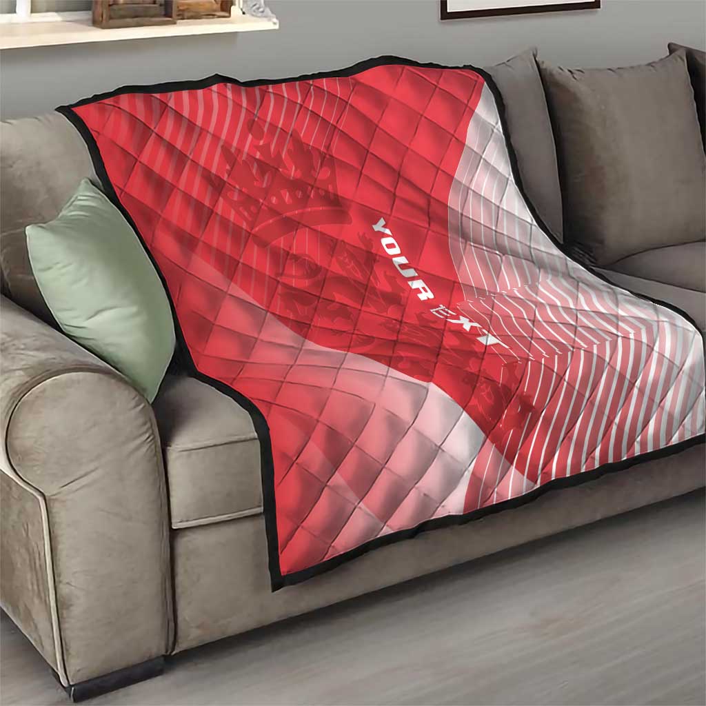 Red and white diagonal quilt blanket with diamond stitching and black border on couch